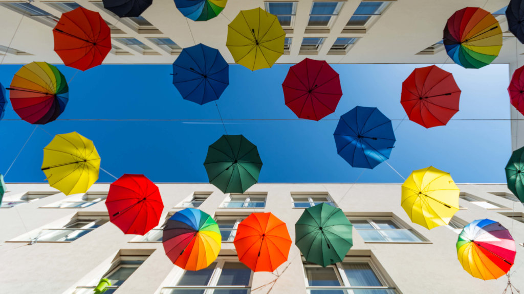 Colorful Hanging Umbrella Between Two Buildings