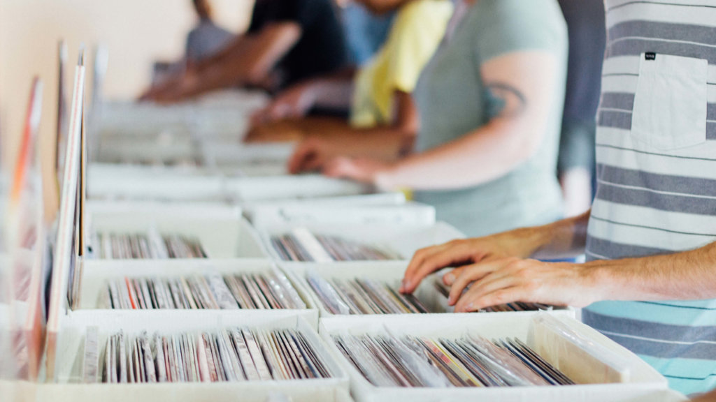 Line People Picking Records Box by Anthony Martino on Unsplash